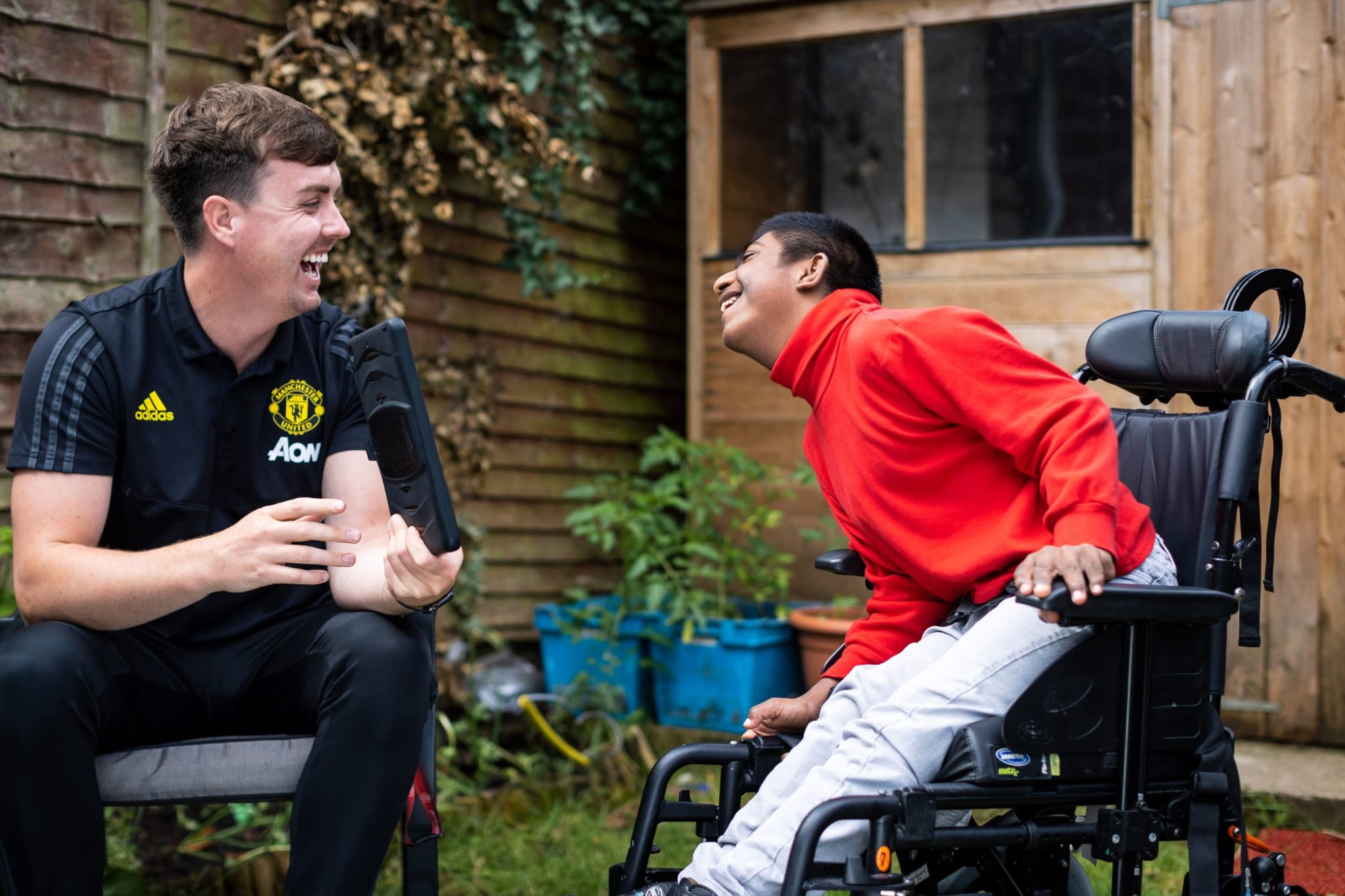Wheelchair user with Manchester United foundation coach